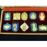 A Set of 10 Peking Jewellery Chinese gilt metal and enamel pendants, inscriptions verso,