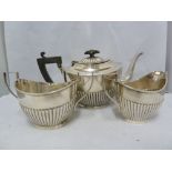 A silver 3 piece tea service, of half gadrooned London shape, comprising tea pot, milk jug, and