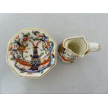 A porcelain miniature washbowl and ewer, decorated in Mason's Ironstone style with an imari pattern,