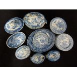 An English pearlware pottery toy service, printed in blue with a willow type pattern, comprises,