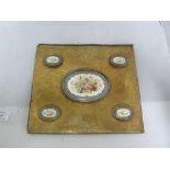 A Victorian porcelain mounted brass desk blotter, set with oval porcelain plaques and decorated in