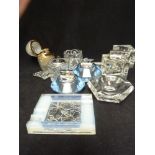 A Verlys Opaline glass ashtray, decorated with butterflies; four table cigarette lighters; two