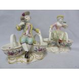 A pair of Continental porcelain salts, in Meissen Style, formed as a gallant and companion each