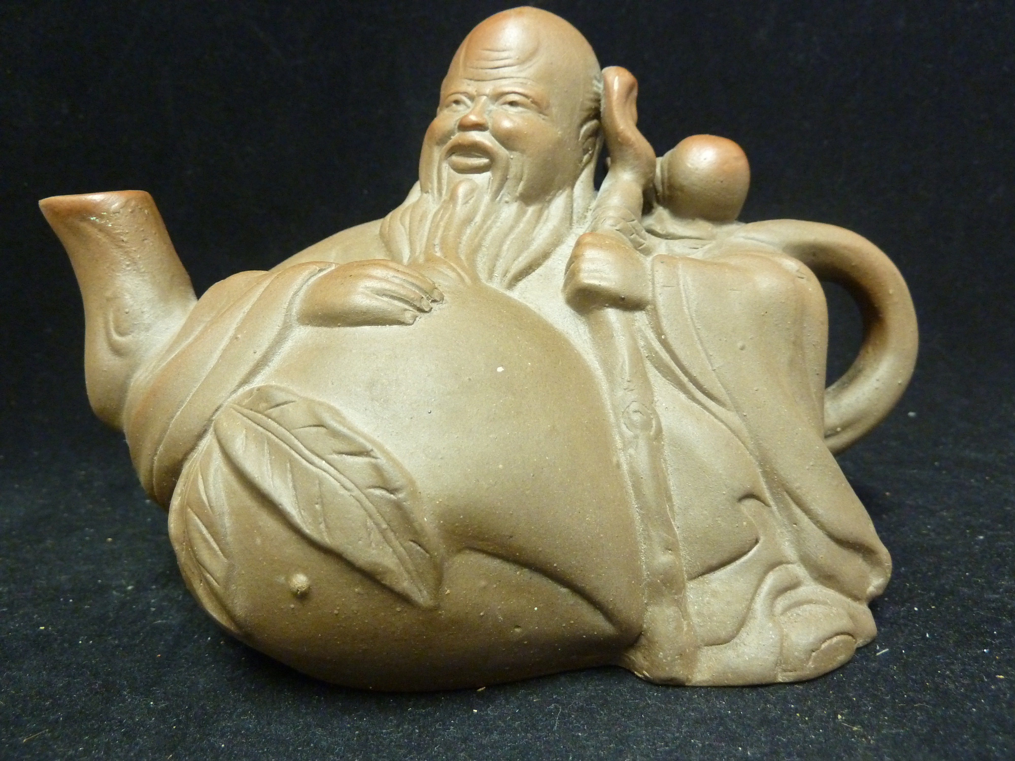 A Chinese Yixing pottery teapot and cover, in the form of a sage; and four Straights type - Image 2 of 8