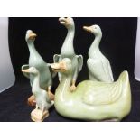 A large collection of Chinese porcelain figures of ducks in various poses, green colouration (qty)