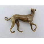 A small bronze figure of a grey hound, naturalistically modelled probably after the Antique, 8cm max