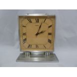 A Garrard 8 Day Art Deco Chromium mantel clock, the square dial with scroll surmount on a stepped