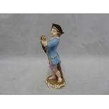 A Meissen porcelain figure, of a boy profering a posy, polychrome decorated, on gilded 'C'scroll