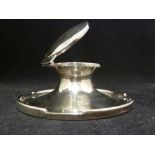 A silver capstan form inkwell, with glass liner to well, Birmingham 1912, makers mark worn, 13cm