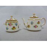 A Mintons Miniature porcelain teapot and cover, painted in polychrome colours with scattered