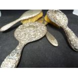 Various silver dressing table items comprising 2 hand mirrors and two hair brushes (4)