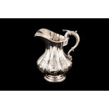 A VICTORIAN SILVER JUG