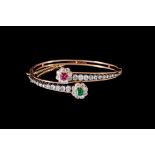 AN EMERALD, RUBY AND DIAMOND BANGLE