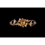 A CITRINE SET SCOTTISH THISTLE BROOCH, mounted in 9ct gold