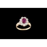 A RUBY AND DIAMOND OVAL CLUSTER RING, with one oval cut ruby of 1.38ct with gem report and