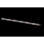 AN ART DECO DIAMOND BRACELET, mounted in 18ct white gold, French