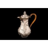 A GEORGE III IRISH SILVER COFFEE POT, with chased and engraved repousse decoration, Dublin 1770's,