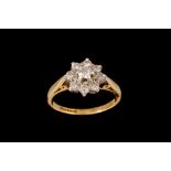 A DIAMOND CLUSTER RING, of approx. 0.60ct in total, mounted in 18ct yellow gold