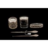 A COLLECTION COMPRISING OF TWO ANTIQUE SILVER MOUNTED TOILET CUT GLASS BOTTLES, letter opener,