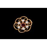 A GARNET AND SEED PEARL BROOCH, mounted in 9ct gold