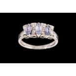 A TANZANITE AND DIAMOND RING, mounted on 14ct white gold