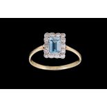 AN AQUAMARINE AND DIAMOND CLUSTER RING, with aquamarine of approx. 0.45ct