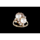 A CULTURED PEARL AND DIAMOND RING, with diamonds of approx. 0.63ct in total, mounted in 14ct