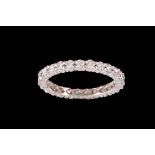 A DIAMOND ETERNITY RING, of approx. 1.00ct in total G VS, mounted in 18ct white gold, size L