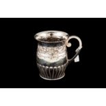 A GEORGE V SILVER ONE PINT BEER MUG, with chased and engraved repousse floral decoration,