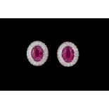 A PAIR OF RUBY AND DIAMOND OVAL CLUSTER EARRINGS, with rubies of approx. 3.15ct, diamonds of approx.