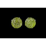 A PAIR OF FLORAL CARVED CABOCHON PERIDOT EARRINGS.