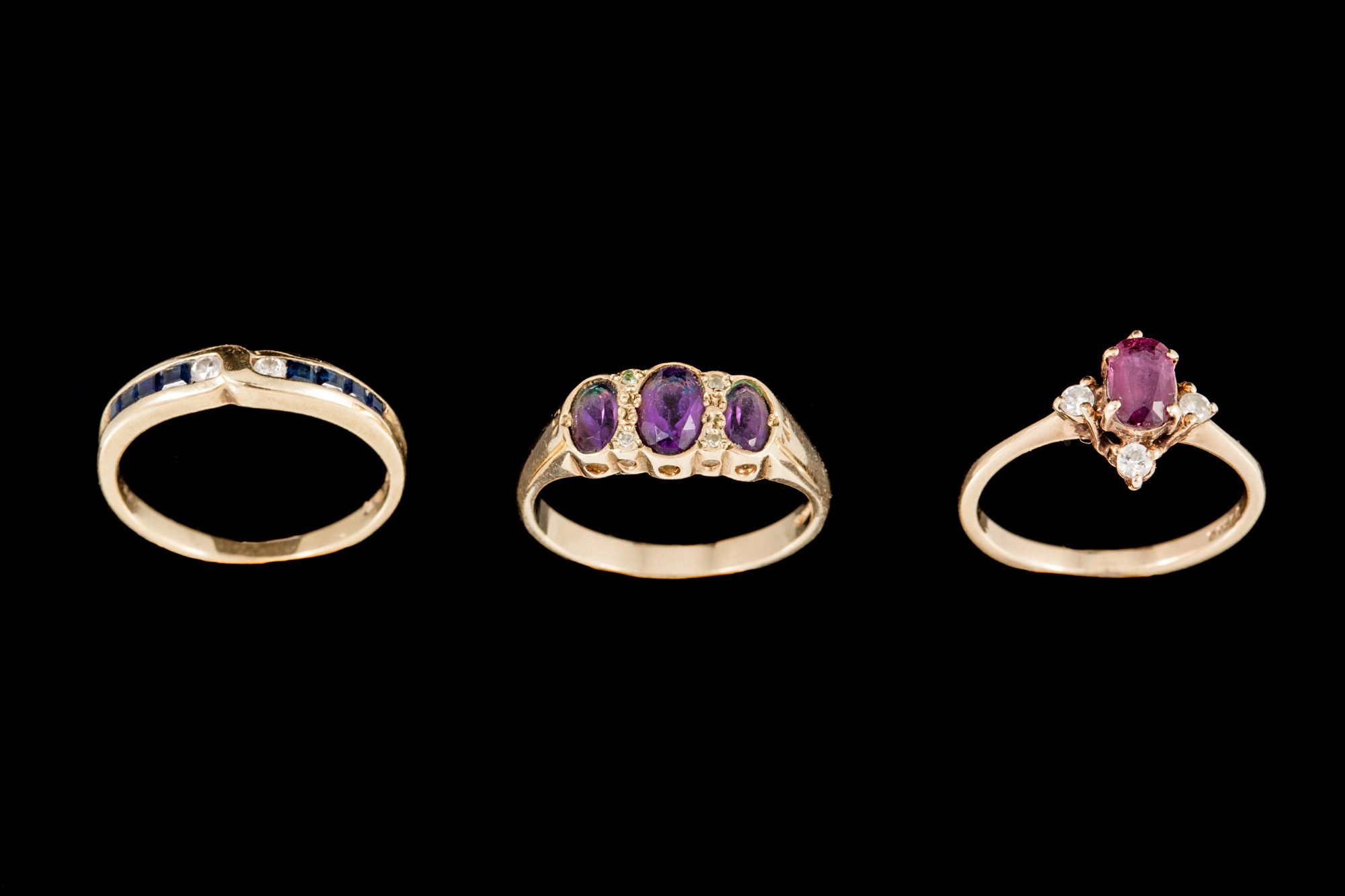 THREE GEM SET RINGS, mounted in 9ct gold