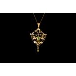 AN EDWARDIAN PERIDOT AND SEED PEARL PENDANT, on chain