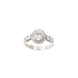 A DIAMOND HALO CLUSTER RING, one round brilliant cut diamond of approx 1.10ct H/I SI set at