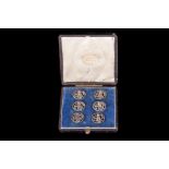 A SET OF SIX LATE VICTORIAN SILVER BUTTONS, HM 1900, cased, retailed by Mappin & Webb