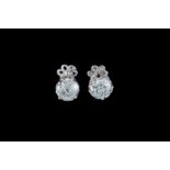 A PAIR OF DIAMOND SOLITAIRE STUD EARRINGS, with two old European cut diamonds of approx 1.34ct in