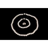 A CULTURED PEARL NECKLACE, with silver clasp; together with a matching bracelet and pair of