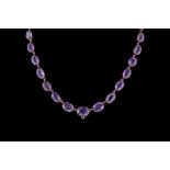 AN ANTIQUE AMETHYST LINK NECKLACE.