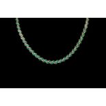 AN EMERALD AND DIAMOND NECKLACE, mounted in 14ct gold