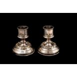 A PAIR OF 19TH CENTURY SILVER PLATED CANDLESTICKS