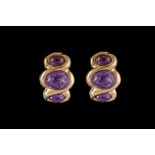A PAIR OF CABOCHON AMETHYST CLIP EARRINGS, 18ct yellow gold.