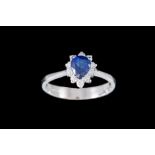 A SAPPHIRE AND DIAMOND PEAR SHAPED CLUSTER RING, with sapphire of approx. 0.95ct, diamonds of