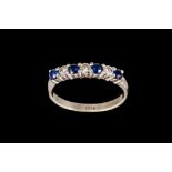 A SAPPHIRE AND DIAMOND HALF ETERNITY RING, with sapphire of approx. 0.40ct, diamonds of approx. 0.