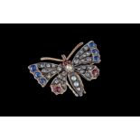 AN ANTIQUE BUTTERFLY BROOCH, set throughout with rubies, sapphires, rose cut diamonds and split