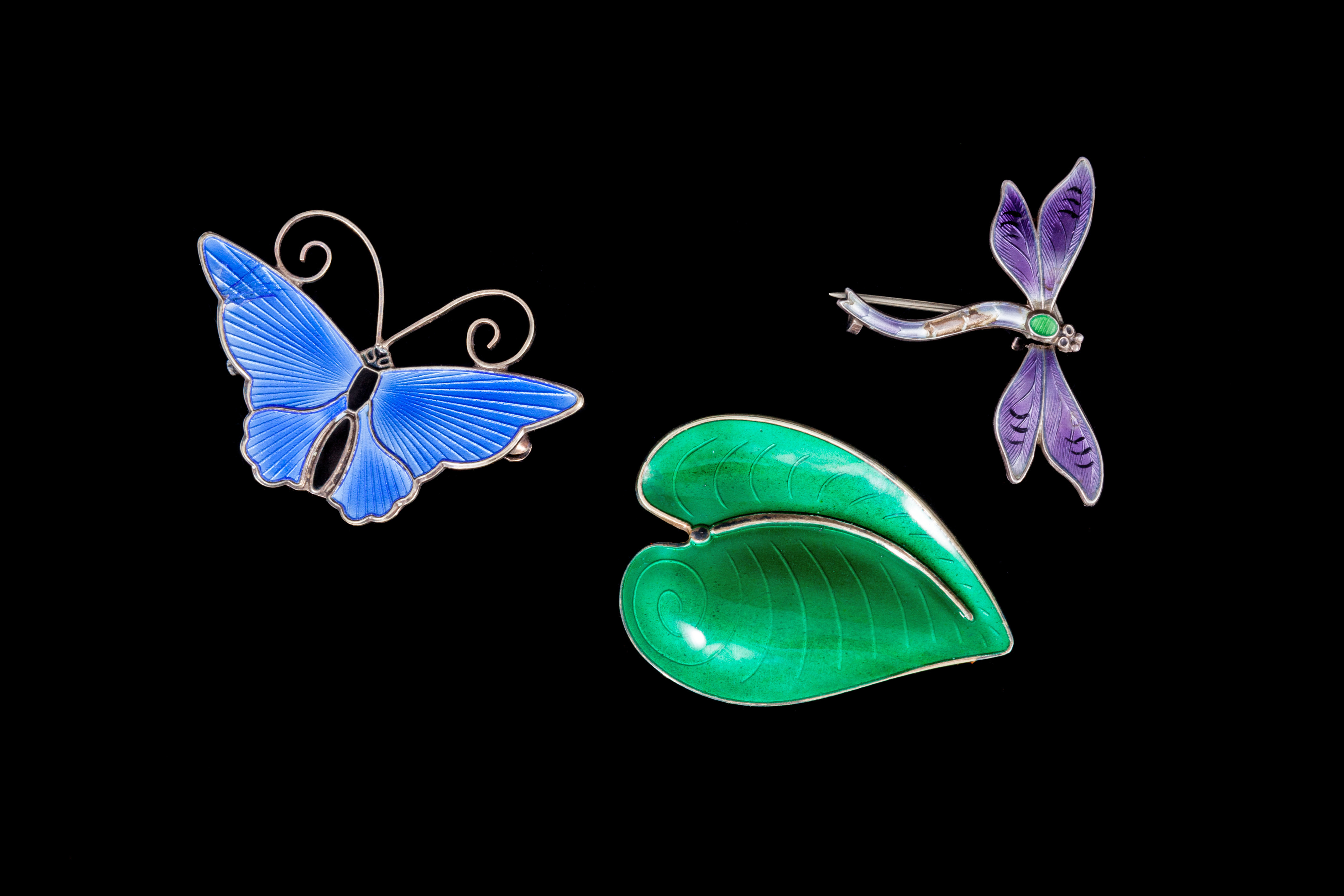 THREE ENAMEL BROOCHES, on silver, Norway