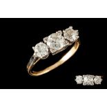 A DIAMOND THREE STONE RING, of approx. 1.65ct in total, mounted in 18ct gold and platinum, circa