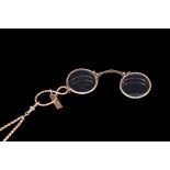 AN ANTIQUE LORGNETTE, on 9ct gold muff chain