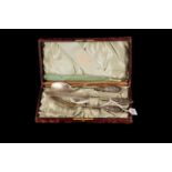 AN ANTIQUE USA STERLING SILVER THREE PIECE CHRISTENING SET, retailed by Philip Rein, cased