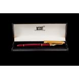 A MONT BLANC BURGUNDY FOUNTAIN PEN, with 18ct gold nib, boxed