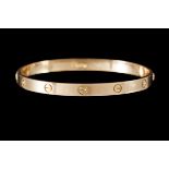 A CARTIER LOVE BANGLE, in 18ct yellow gold